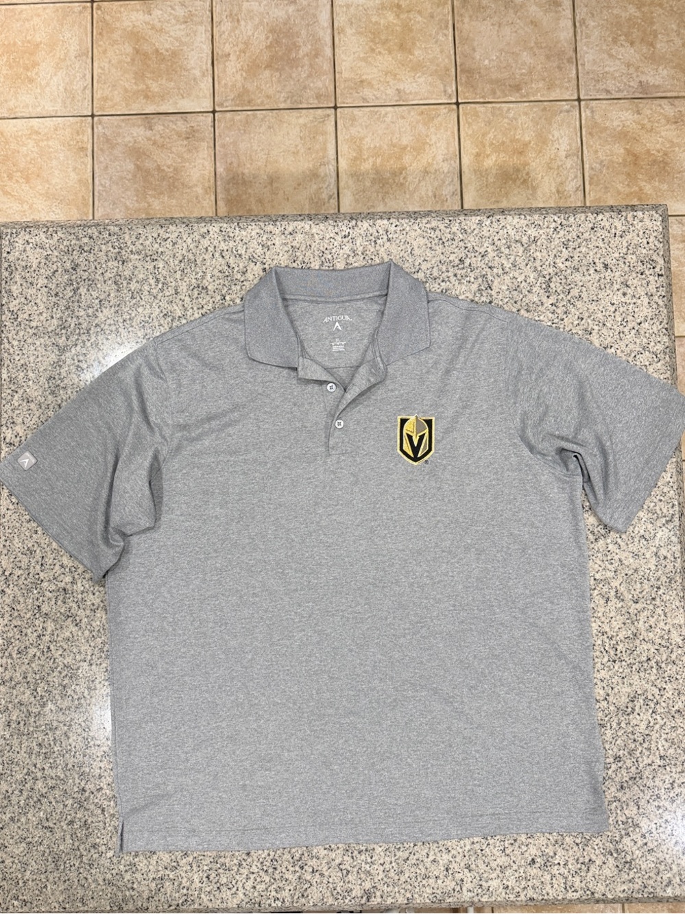 Antigua Gray Polo with Las Vegas Knight’s Gold & Black Shield Patch